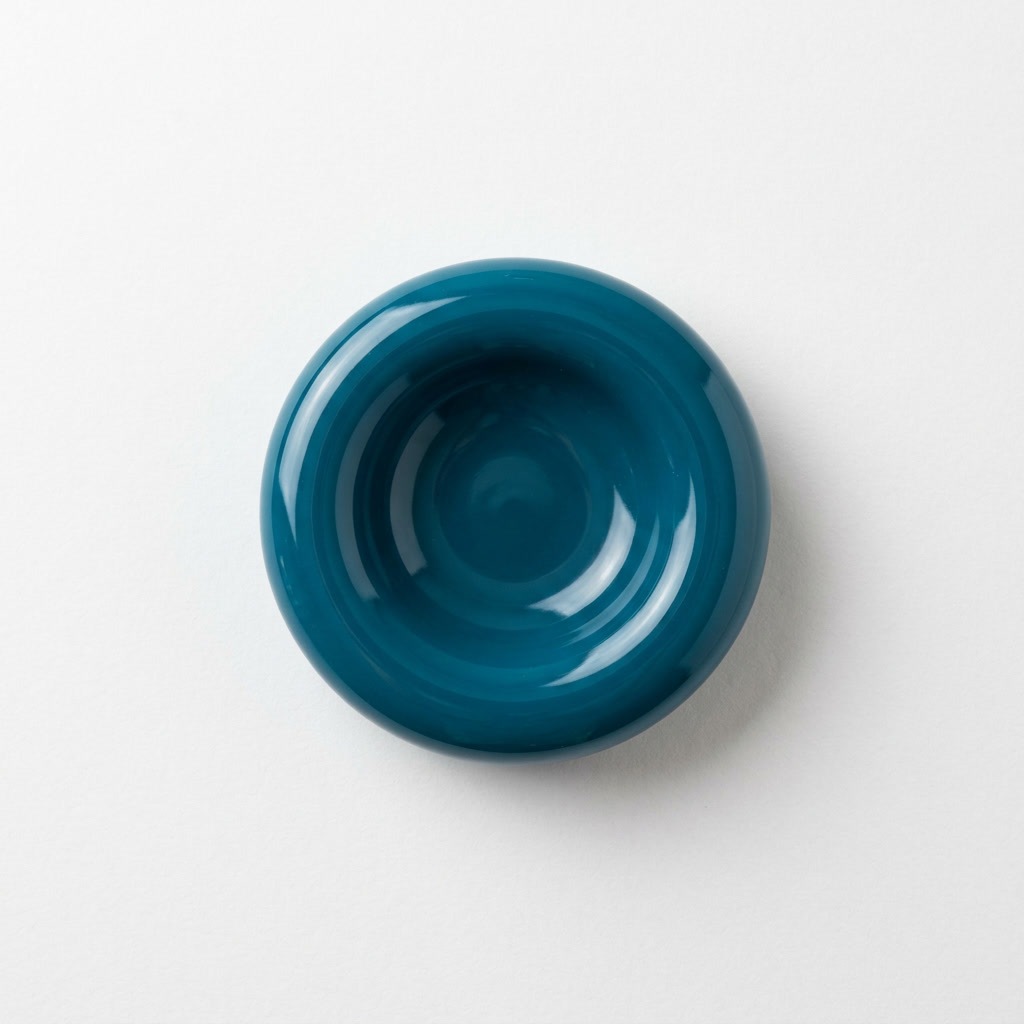 Resin shrinkage — concave depression in teal casting